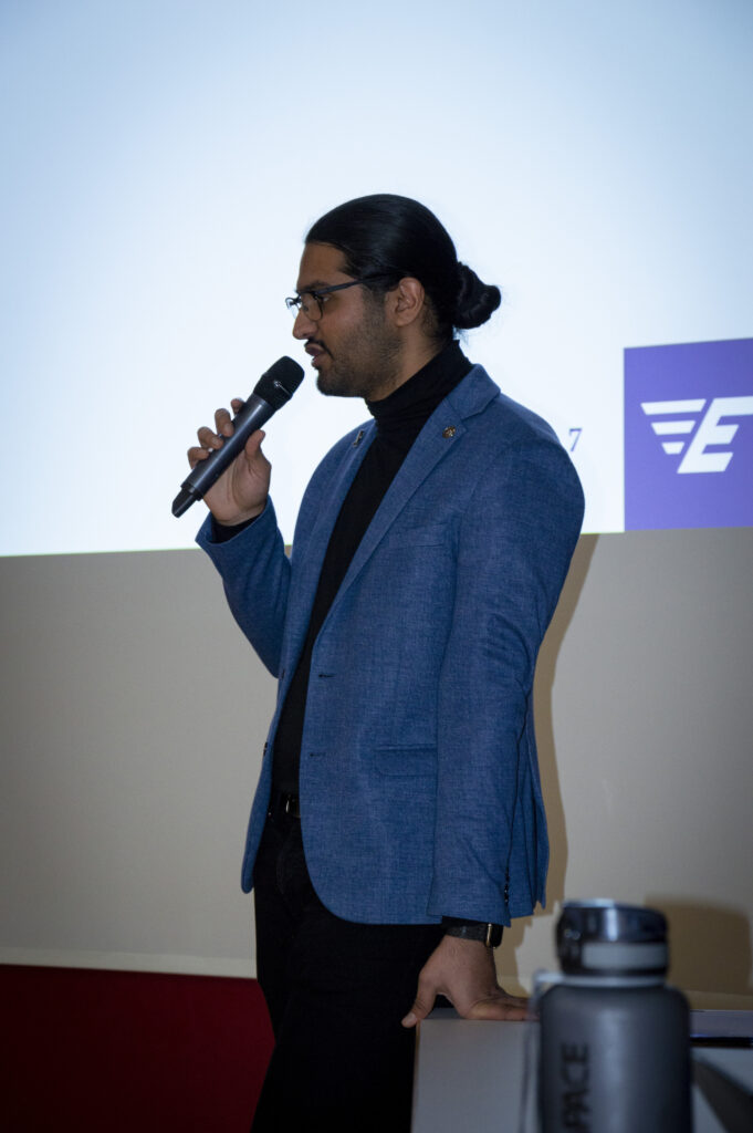 Photo of Pavi speaking at an event